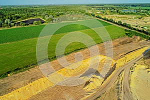 Aerial view Gravel quarrying from the air in a gravel pit