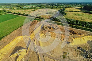 Aerial view Gravel quarrying from the air in a gravel pit