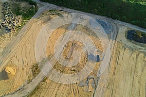 Aerial view Gravel quarrying from the air in a gravel pit