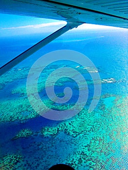 Aerial view Great Barrier Reef from sky out of air plane