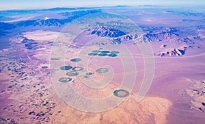 Green circle formed by center pivot irrigation farm photo