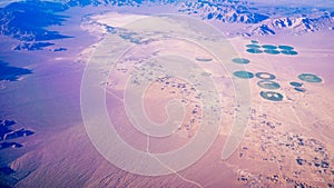 Green circle formed by center pivot irrigation farm photo
