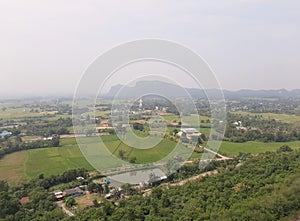 Aerial view of green field on cloudy day