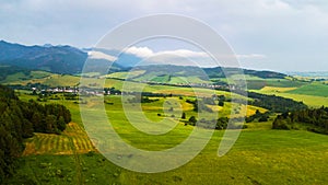 Aerial view of a green field in the Tatra Mountains in summer