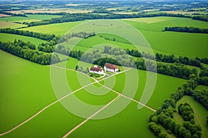 an aerial view of green fields.