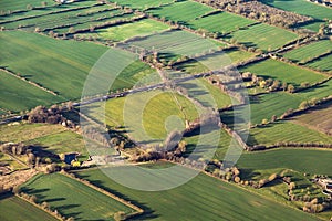 Aerial view of green fields and slopes