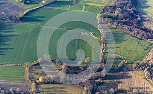 Aerial view of green fields and slopes