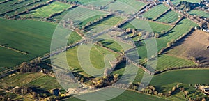 Aerial view of green fields and slopes