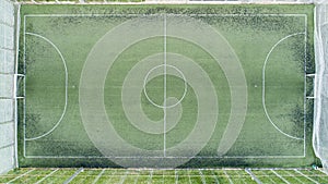 Aerial view of green football, soccer pitch. Top down view on a green, empty soccer field