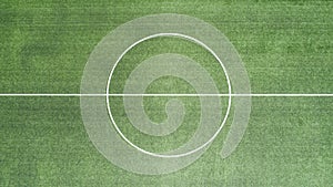 Aerial view of green football, soccer pitch. Top down view on a green, empty soccer field