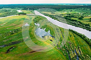 Aerial View. Green Forest, Meadow And River Marsh Landscape In Summer. Top View Of European Nature From High Attitude In