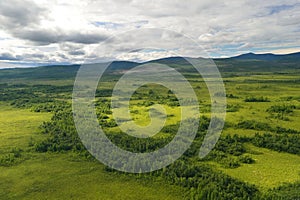 Aerial view of the green forest in the North of Khabarovsk territory, far East, Russia.