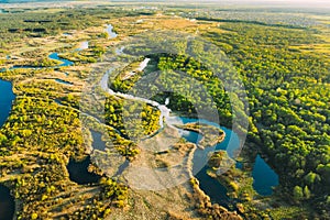 Aerial View Green Forest Woods And River Landscape In Sunny Spring Summer Day. Top View Of Beautiful European Nature