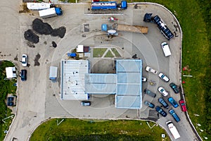 Aerial view of green gas station in the city near the road for cars. The concept of increasing the cost of gasoline and