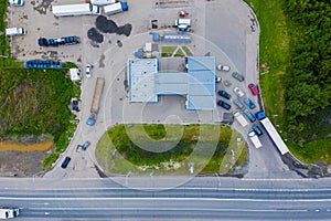 Aerial view of green gas station in the city near the road for cars. The concept of increasing the cost of gasoline and