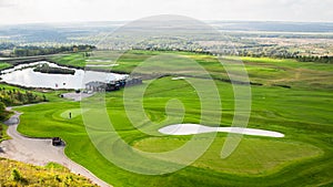 Aerial view of a green golf course, golf course on a sunny day