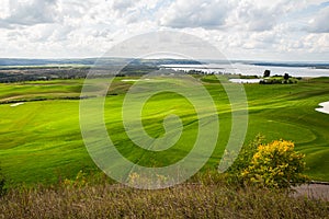 Aerial view of a green golf course, golf course on a sunny day