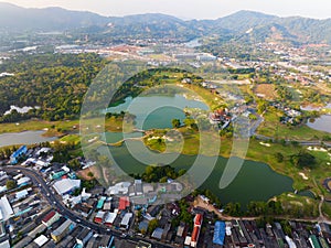 Aerial view of green golf course in Kathu district Phuket Thailand, Drone camera High angle view landscape