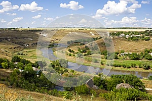 Aerial view of a green rural area under blue sky