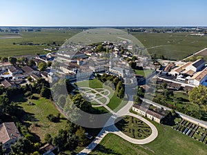 Aerial view on green vineyards, wine domain or chateau in Haut-Medoc red wine making region, Bordeaux, left bank of Gironde