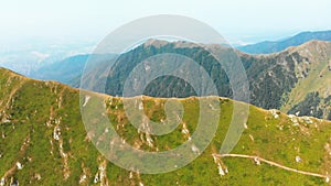 Aerial view group of four hikers hike on Lagodekhi national park black rock trail back