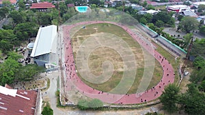 aerial view of a Group of people on the running track