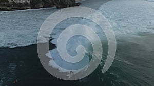 Aerial View Of Group Of Surfers In Ocean In Bali, Indonesia. People Surfboarding.