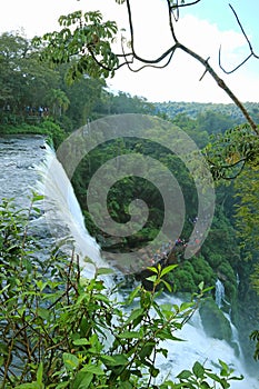 Aerial view of groups of visitors discovering the amazing waterfall seen from the boardwalk, Iguazu Falls at Argentinian side