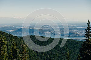 Aerial View of Grouse Mountain with Downtown city. North Vancouver, BC, Canada