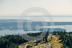 Aerial View of Grouse Mountain with Downtown city. North Vancouver, BC, Canada