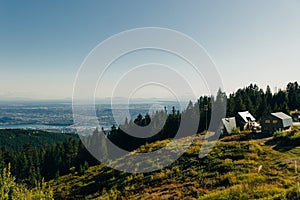 Aerial View of Grouse Mountain with Downtown city. North Vancouver, BC, Canada