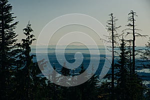 Aerial View of Grouse Mountain with Downtown city. North Vancouver, BC, Canada