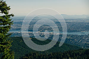 Aerial View of Grouse Mountain with Downtown city. North Vancouver, BC, Canada