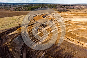 Aerial view of a growing sand pit at the expense of fields