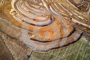Aerial view of a growing sand pit at the expense of fields