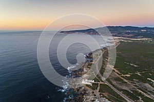 Aerial view of the Guincho area, with the Cabo Raso Lighthouse, the scenic road along the coast and the Roca Cape Cabo da Roca o photo