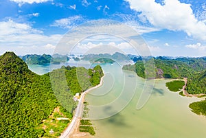 Aerial view of Ha Long Bay from Cat Ba island, famous tourism destination in Vietnam. Scenic blue sky with clouds, limestone rock