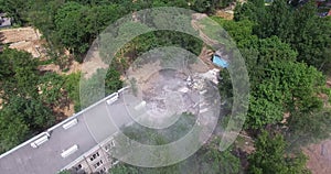 Aerial view of half demolished old panel apartment house