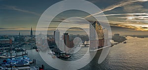 Aerial view of Hamburg at sunrise with a concert hall in the foreground and Speicherstadt/Hafencity