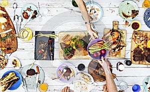 Aerial view of hands sharing food together