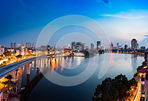 Aerial view of Hanoi cityscape by twilight period, with Da lake and under construction Cat Linh - Ha elevated railway