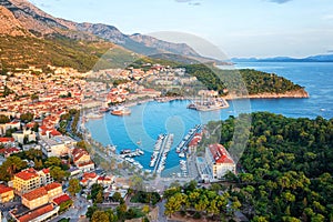 Aerial view of the harbor and old town, Makarska, Dalmatia, Croatia. Travel background with yachts, sea, architecture and rocks