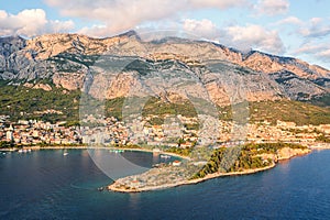 Aerial view of the harbor and old town, Makarska, Dalmatia, Croatia. Travel background with yachts, sea, architecture and rocks