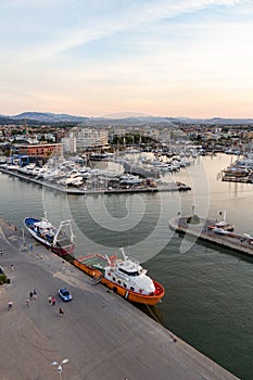 Aerial view of harbour, city and coastline at sunset seen from panoramic ferris wheel at Rimini Italy