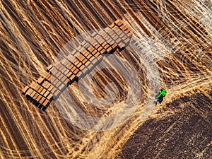 Aerial view of harvest field and hay bales