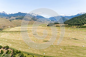 Aerial view of harvested Hay field with mountains in background, Carretera Austral route - Coyhaique, AysÃ©n, Chile