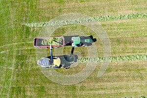 aerial view of Harvester cutting field, loading Silage into a Tractor Trailer photo