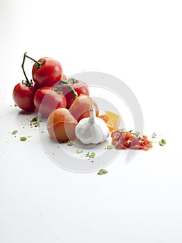 Aerial view of a head of garlic, crushed tomatoes and chives 3 photo