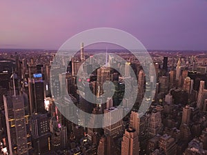 Aerial View of the heart of Manhattan, New York City with Tall Skyscrapers right After Sunset in Dusk light