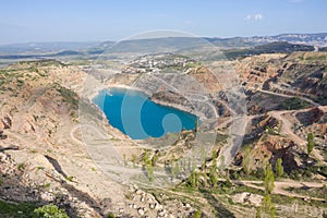 Aerial view of Heart shaped blue quarry lake. Kadykovsky quarry, Balaklava, Crimea.